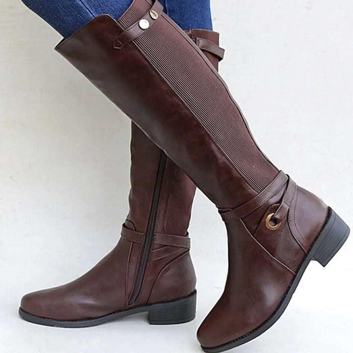 Stylish women's black leather orthopedic boots, featuring durable design and cushioned support for casual wear.