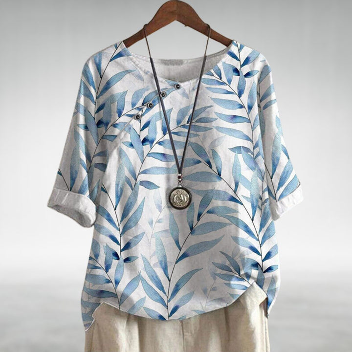 Versatile women's printed blouse with asymmetric buttons, ideal for elegant everyday fashion.