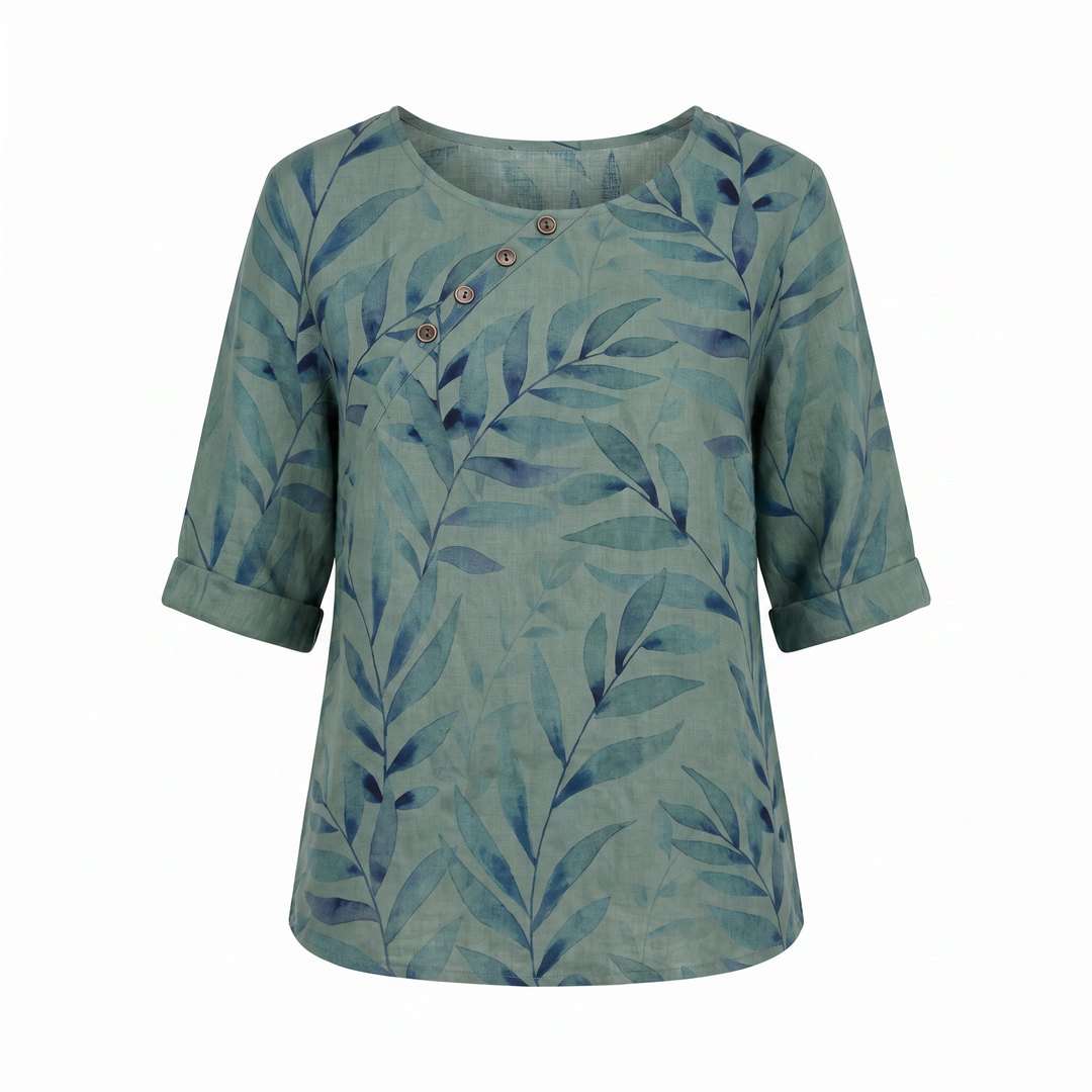 Green women's printed blouse with elegant leaf pattern & chic asymmetric button closure.