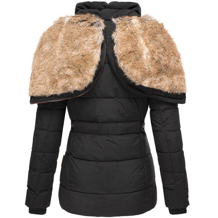 Back view of a women's puffer jacket, emphasizing its quilted design and the fullness of the faux fur hood.