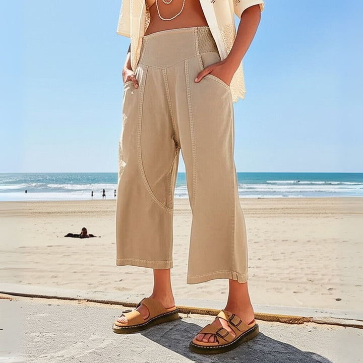 Close-up of the cotton linen texture on women's relaxed wide leg pants, showing fabric detail.
