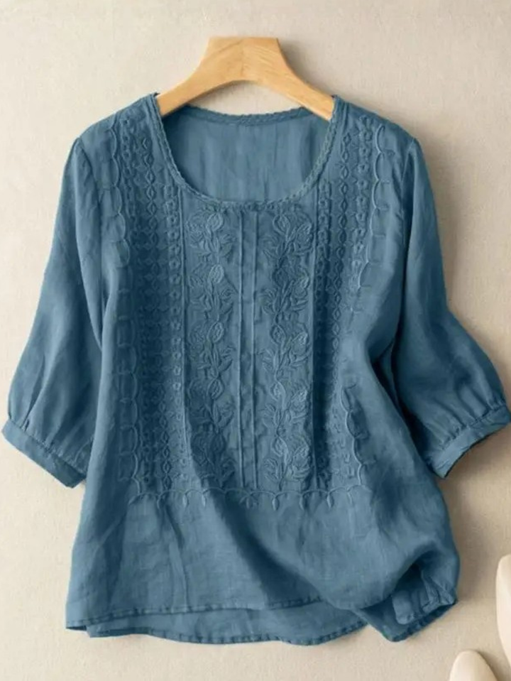 Versatile women's embroidered blouse, relaxed fit, perfect for spring fashion or elegant summer casual wear.