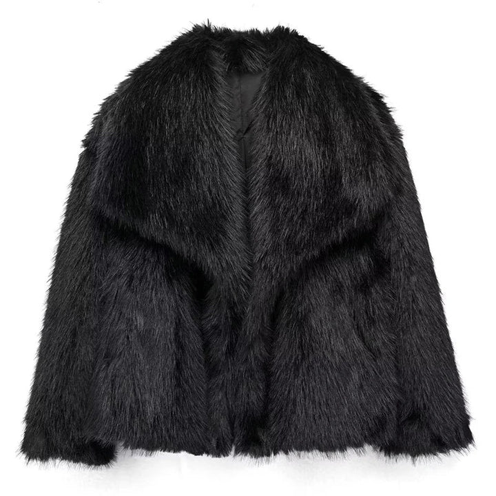 Model smiling while wearing a chic women's relaxed fit faux fur jacket, a must-have for winter elegance.