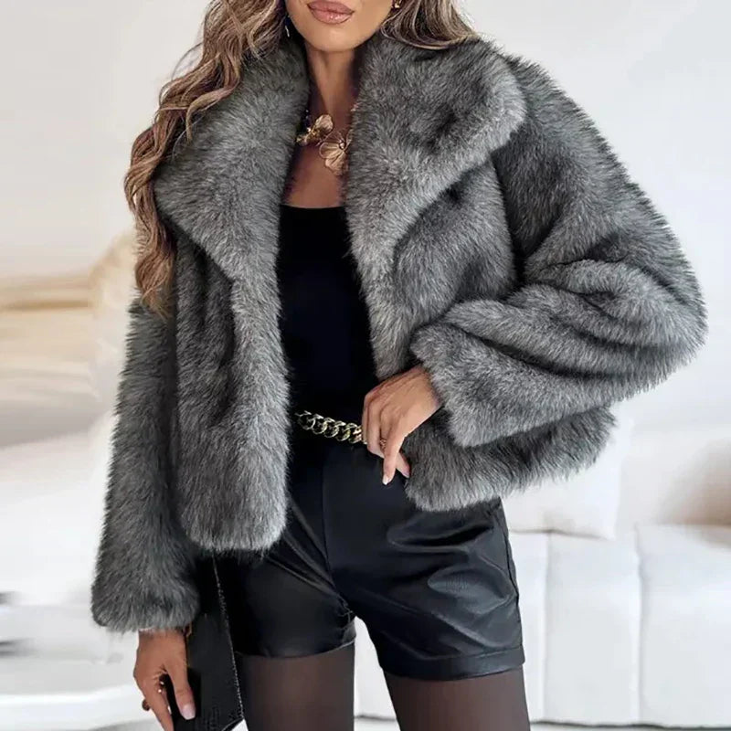 Full-length view of a women's relaxed fit faux fur jacket with stylish lapels, perfect for cold weather.