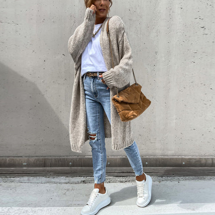 Women's relaxed fit long open front cardigan in a cozy knit, perfect for fall layering.
