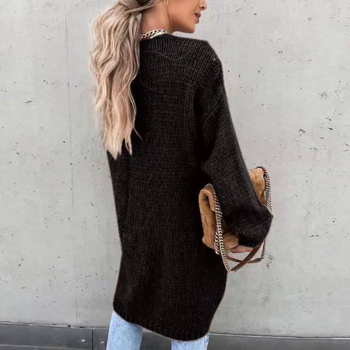 Fashionable women's long open front cardigan, a relaxed fit layering piece for casual wear.