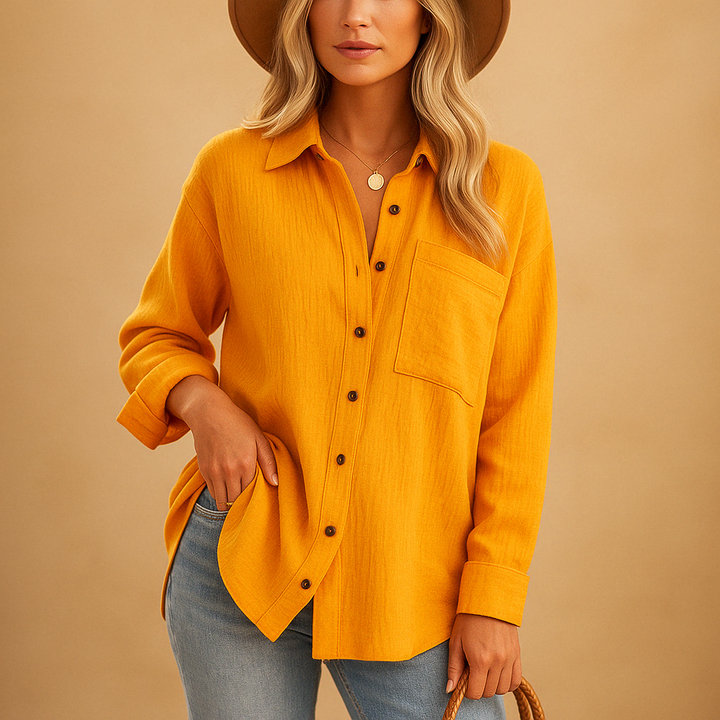 Versatile women's long sleeve polo blouse, relaxed fit with button collar, great for work or leisure.
