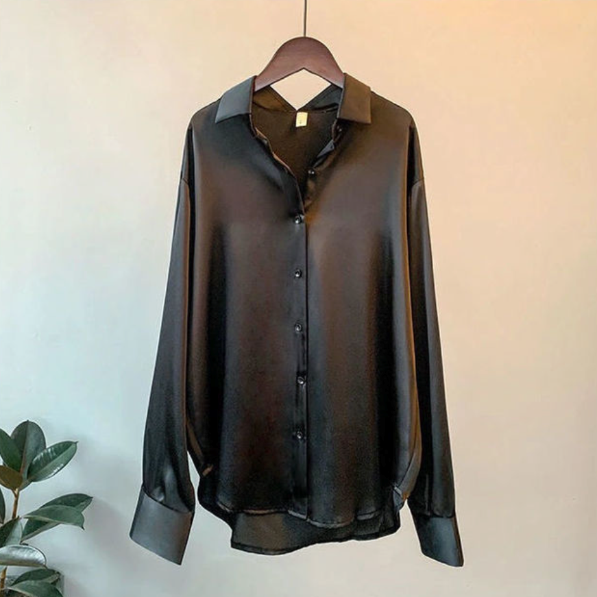 Casual yet elegant women's satin button-down blouse with a relaxed fit, perfect for workwear fashion.