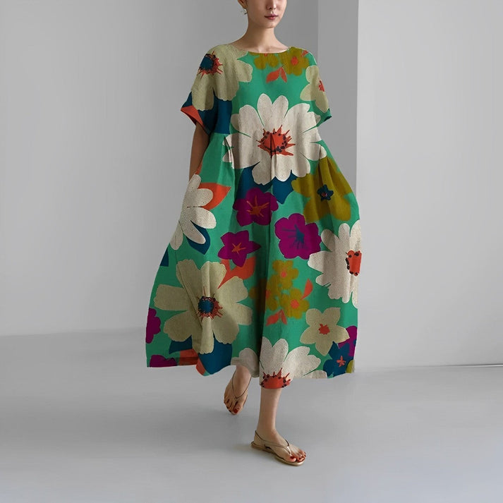 Close-up of a women's relaxed floral print midi dress fabric, showcasing vibrant details.