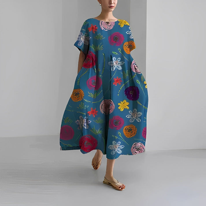 Full shot of a model wearing a relaxed fit floral print midi dress, perfect for warm weather.