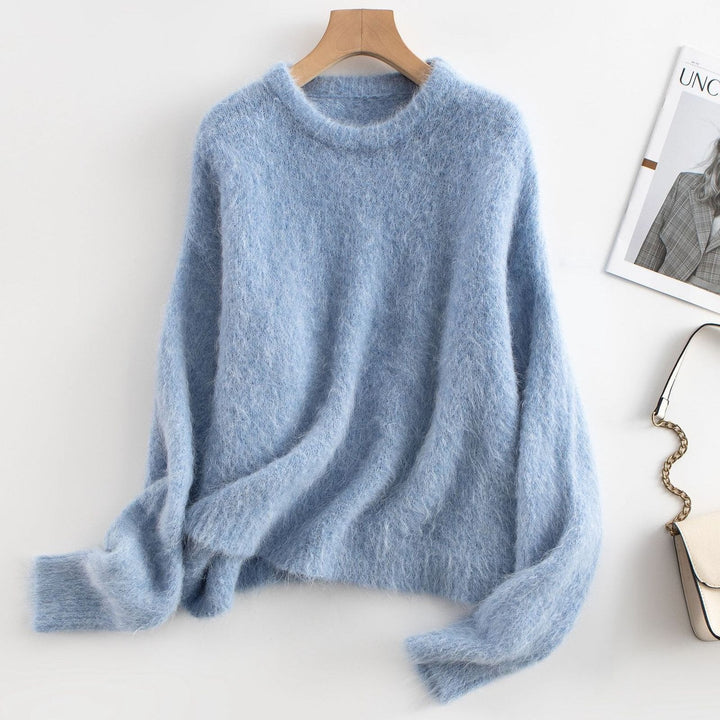 Women's relaxed fit ribbed sweater in a cozy wool blend, perfect for fall fashion.