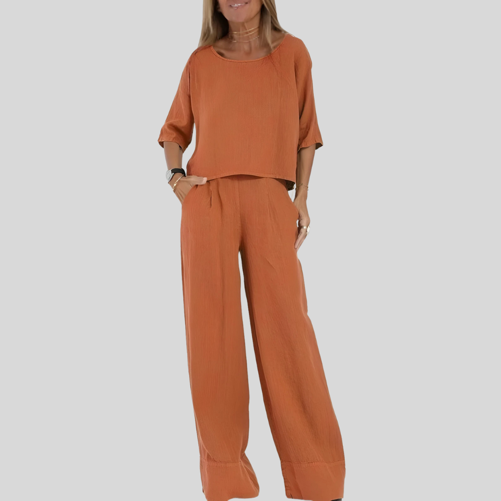 Soft fabric women's two-piece outfit. Relaxed fit top & flowy wide leg pants for ultimate comfort and style.