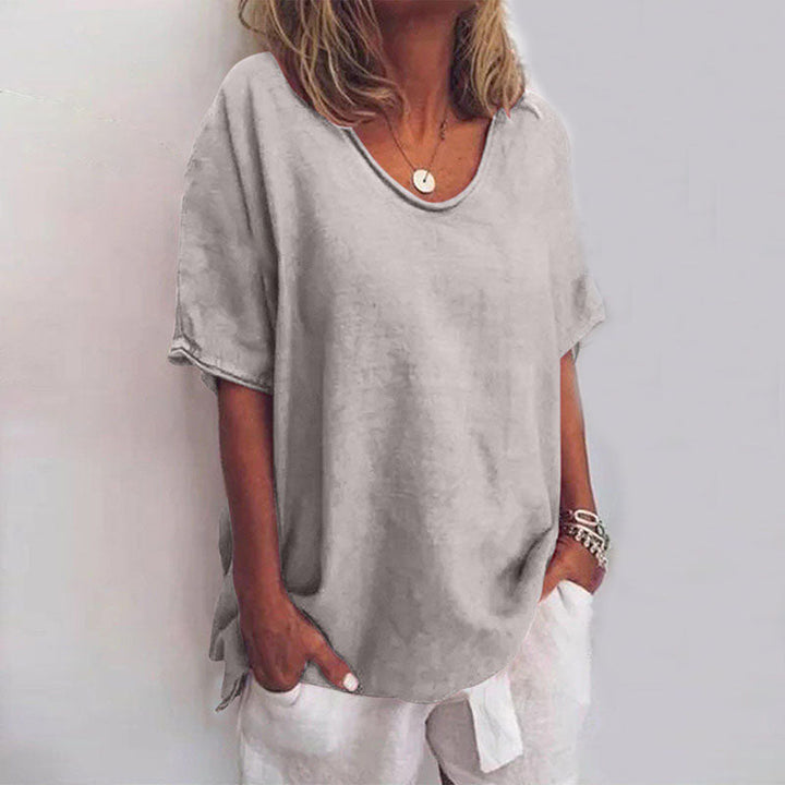 Women's relaxed fit V-neck elbow-sleeve blouse. Perfect chic summer fashion for casual everyday comfort.