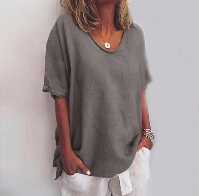 Women's relaxed V-neck elbow-sleeve blouse. Casual wear tunic top for spring & summer fashion. Chic, comfortable style.