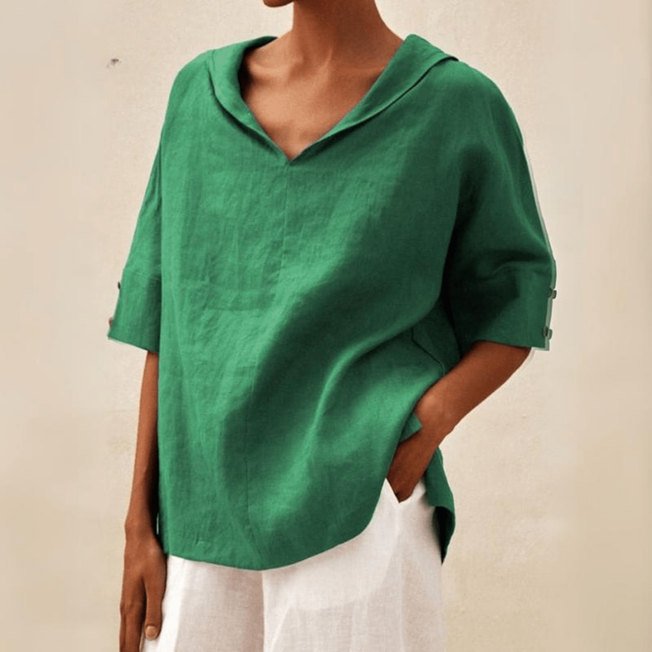 Women's relaxed fit V-neck tunic top, perfect for casual summer style. Comfortable short sleeve blouse.