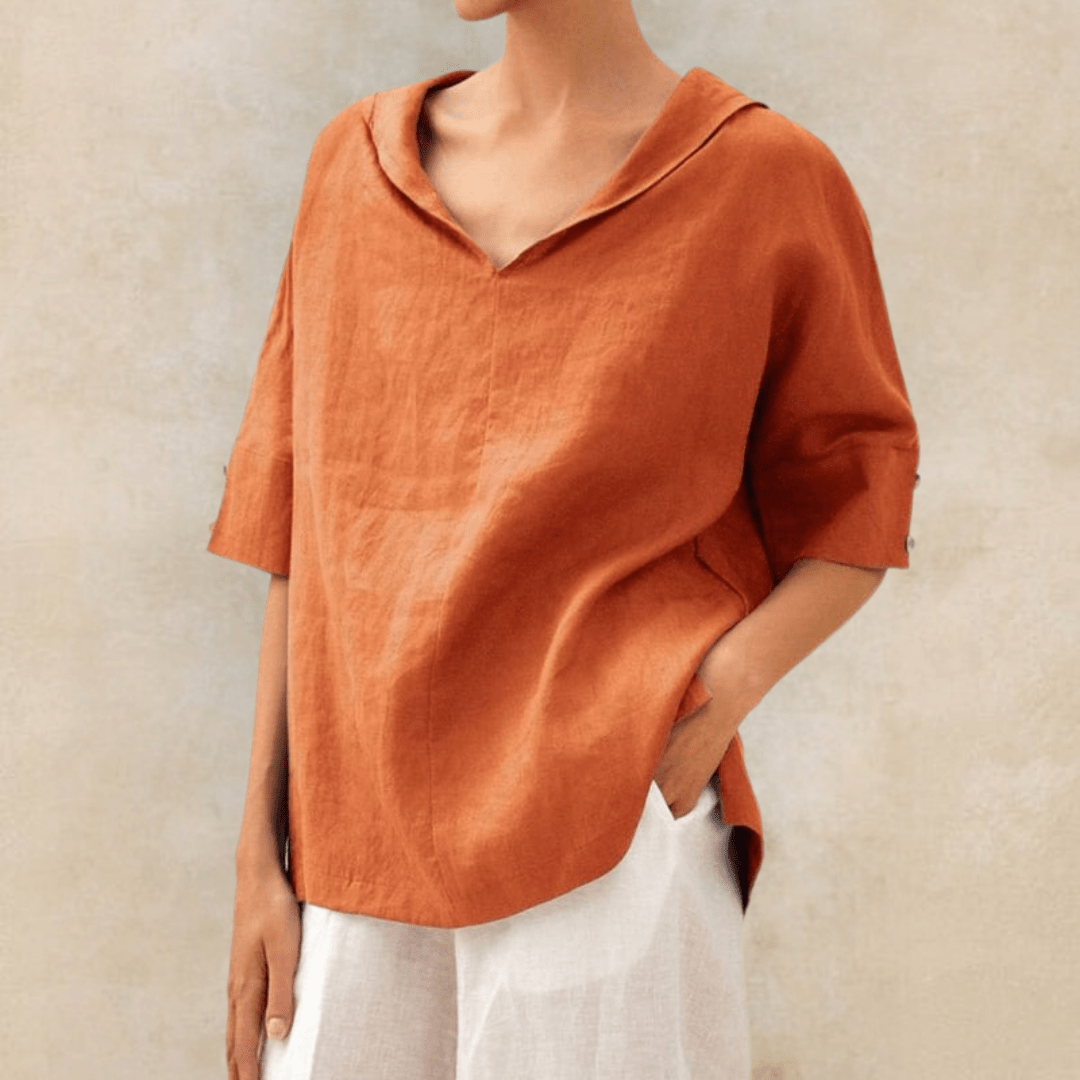 Stylish women's collared V-neck tunic top. Versatile short sleeve blouse with a relaxed fit for spring/summer.
