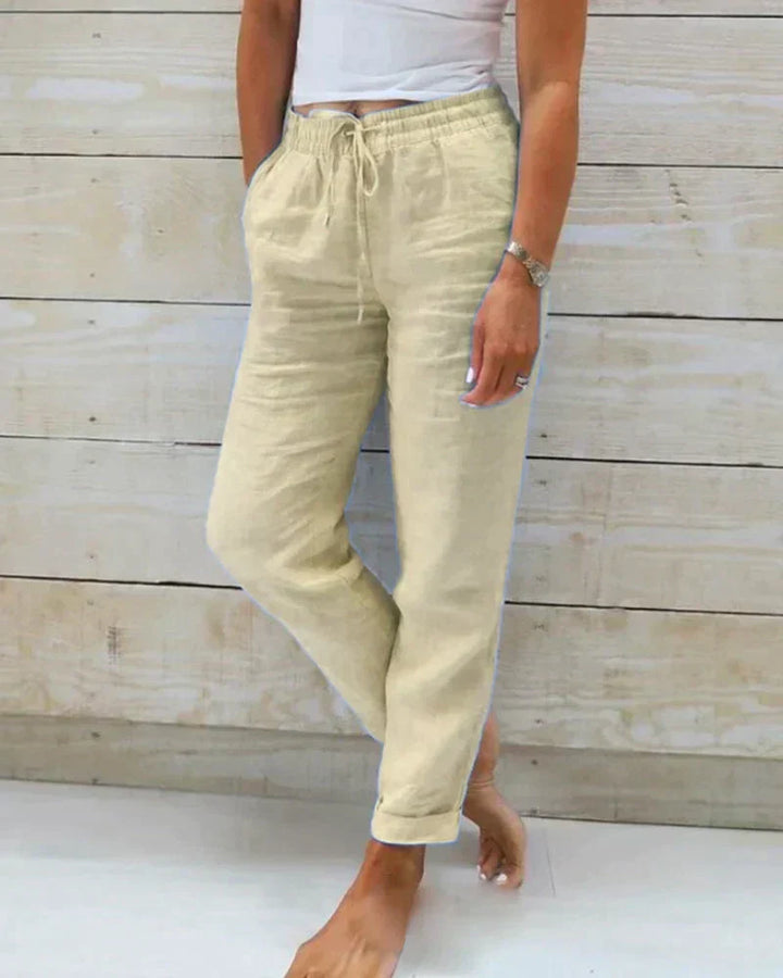 Chic beige wide-leg women's summer pants, relaxed fit for ultimate comfort and warm weather fashion.