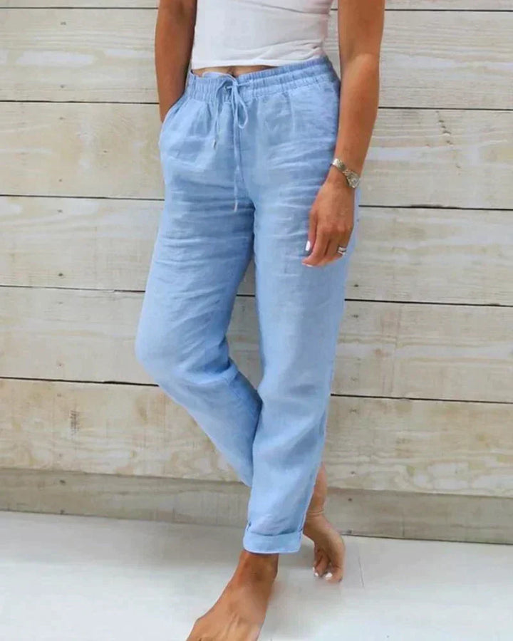 White relaxed fit women's summer pants, perfect for casual wear, everyday style, and warm weather comfort.