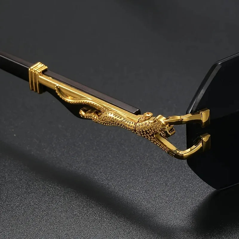 Elegant women's rimless geometric sunglasses. Offers UV protection & features a luxurious gold panther.