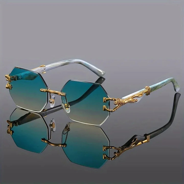 Women's geometric rimless sunglasses featuring gradient lenses & UV protection. Gold panther accents.