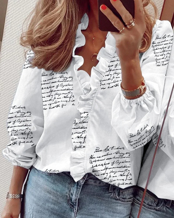 Office chic women's blouse, featuring a V-neck and delicate ruffle trim. Long sleeve, versatile fashion.