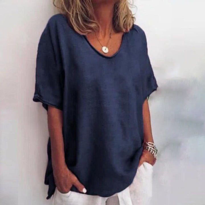 Casual women's scoop neck loose fit blouse. Solid color short sleeve top for versatile everyday wear.