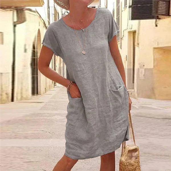 Comfortable women's relaxed fit short sleeve midi dress. Versatile and chic for warm weather and easy everyday wear.