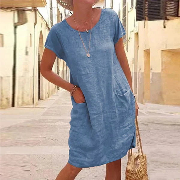 Chic women's short sleeve pocket midi dress. Flowy design for a comfortable, relaxed fit and stylish casual look.