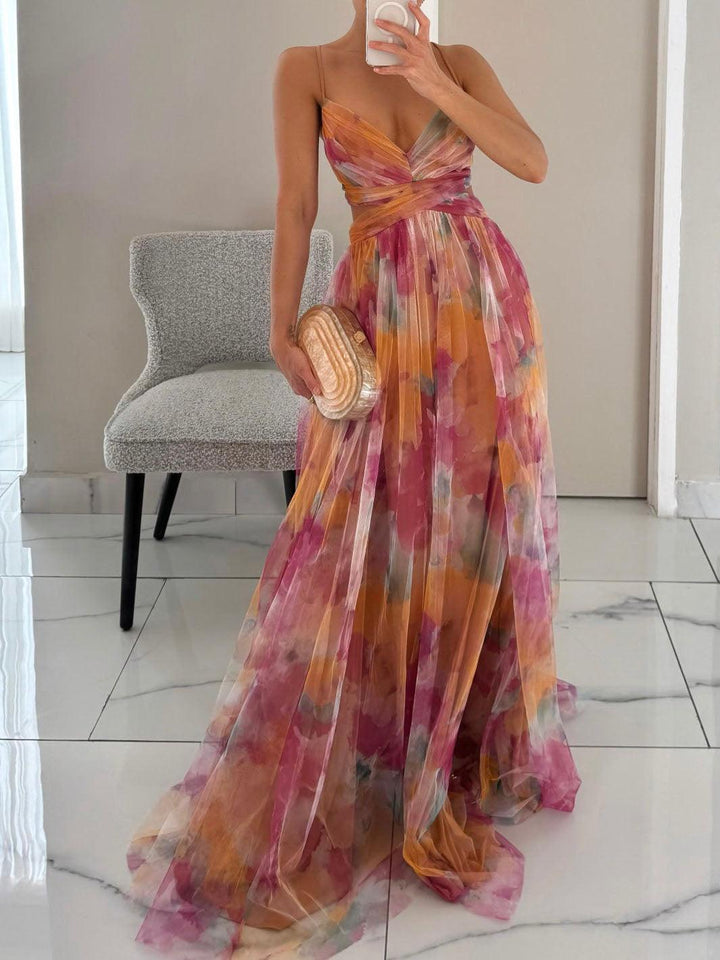 Women's sleeveless floral maxi dress with elegant v-neck & tie waist, perfect for summer occasions.