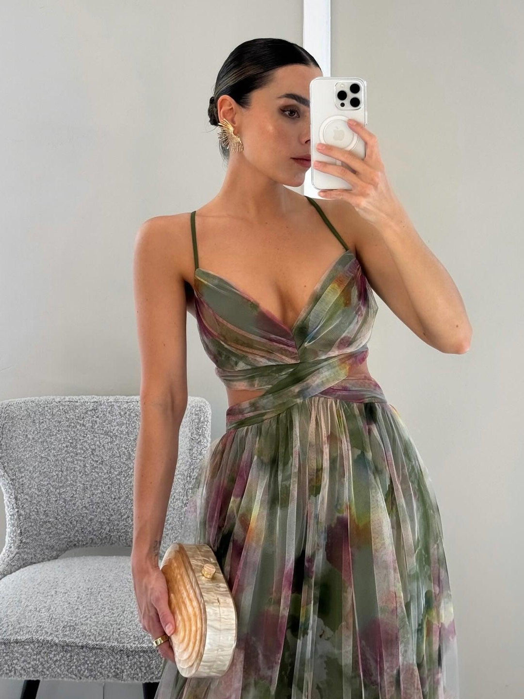 Fashionable women's sleeveless floral maxi dress, a versatile summer and occasion wear with tie-waist.
