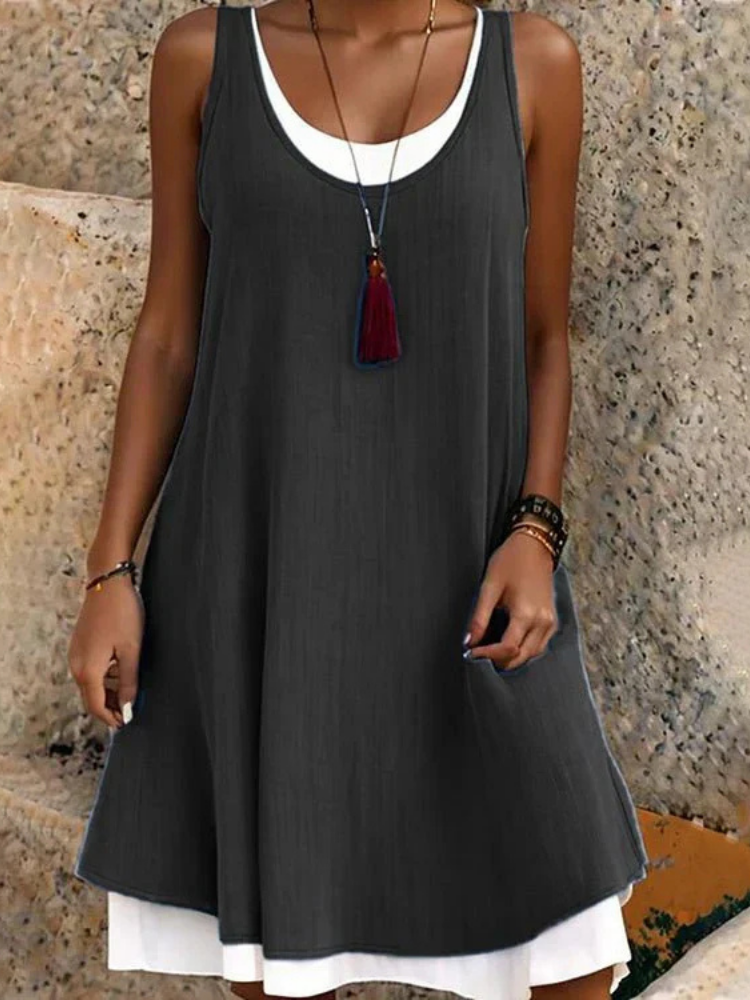 Women's sleeveless scoop-neck A-line midi dress with two layers, perfect for casual summer elegance.