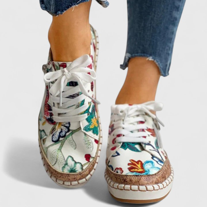Close-up of women's orthopedic casual shoes, highlighting ergonomic design & arch support.