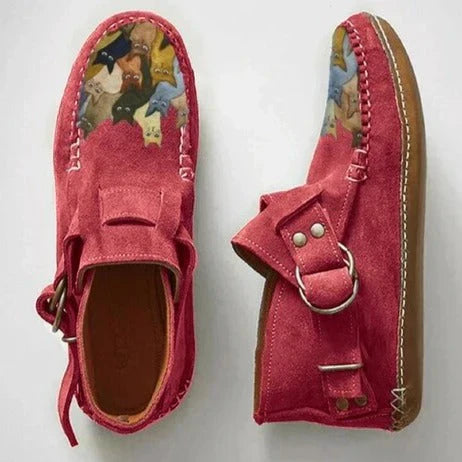 Side view of a women's casual slip-on shoe, displaying the full artistic cat design and flat sole for comfort.