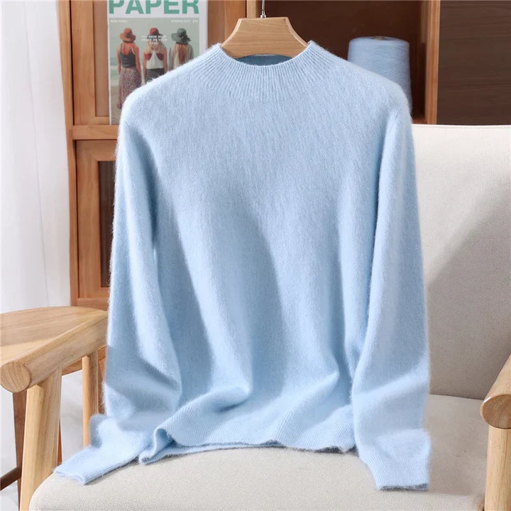 Women's soft cashmere knit sweater top in a cozy mockneck style, perfect for winter layering.