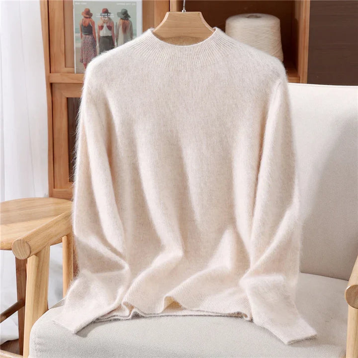 Luxurious women's cashmere knit sweater with a soft mockneck, ideal for fall and winter comfort.