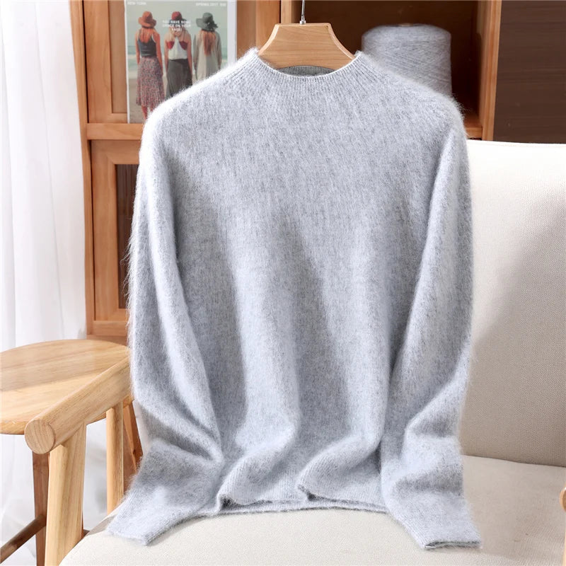 Soft-touch women's cashmere knit sweater with a comfortable mockneck design, a cozy winter top.