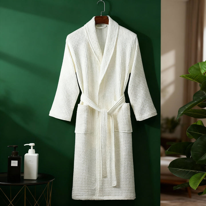 Breathable women's waffle robe with a tie waist, ideal as comfortable lounge wear or sleepwear.