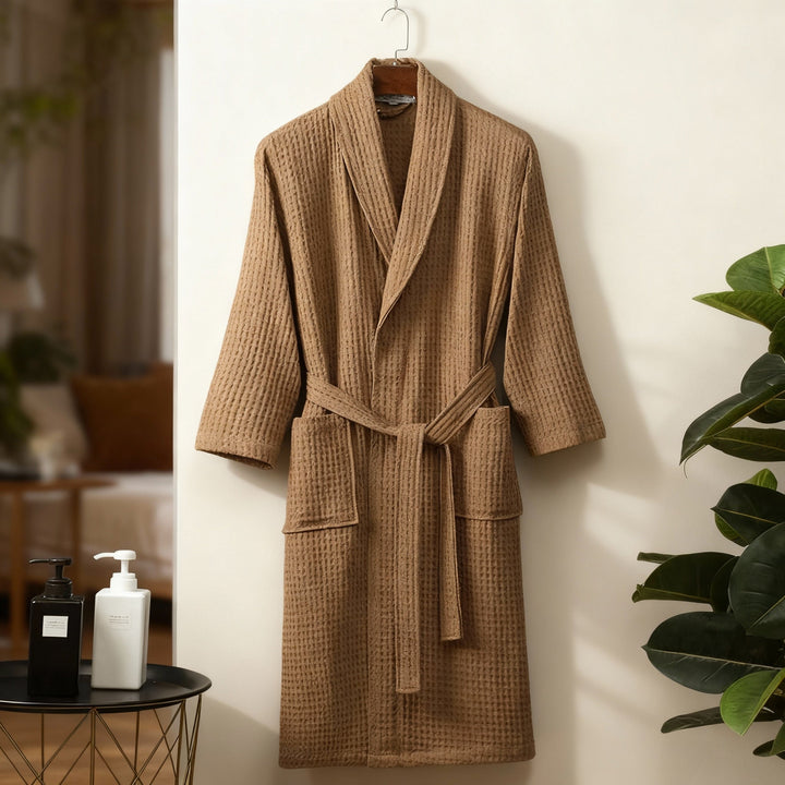A woman wearing a comfortable, soft waffle lounge robe, showcasing its relaxed fit and breathability.