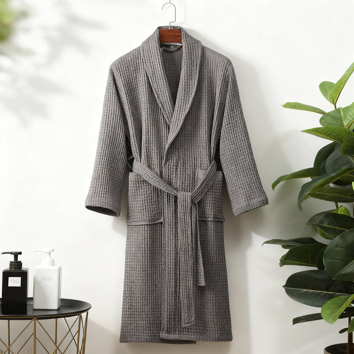 Elegant women's spring robe made from waffle fabric, featuring a chic tie waist for adjustable comfort.