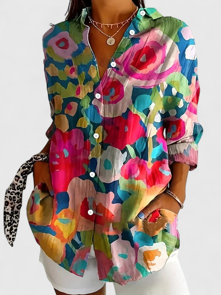 Women's long-sleeve sophisticated blouse featuring a unique, eye-catching print. A versatile and elegant top for spring fashion.
