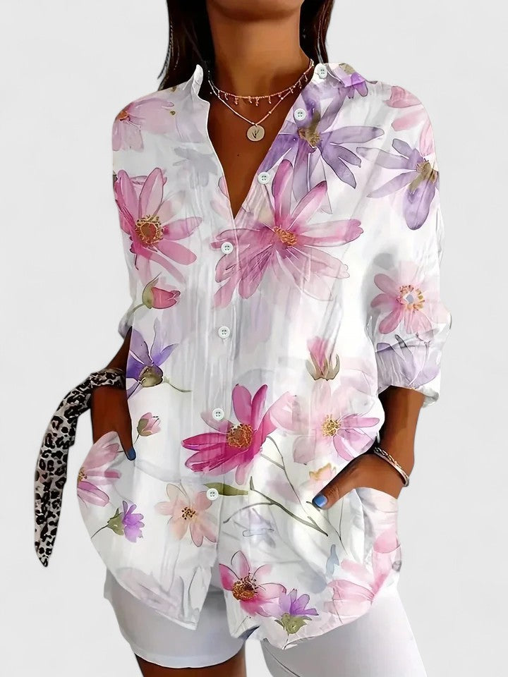 Versatile women's sophisticated print blouse for spring/summer fashion. Elegant long-sleeve top with a unique, eye-catching design.