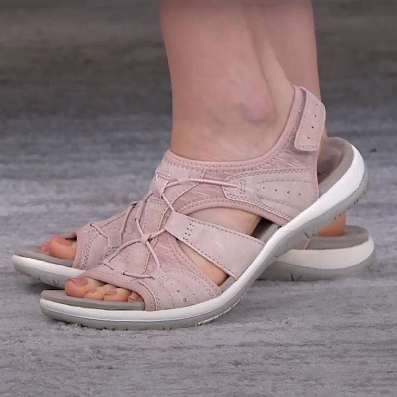 Model wearing women's grey sporty comfort sandals while walking outdoors in spring
