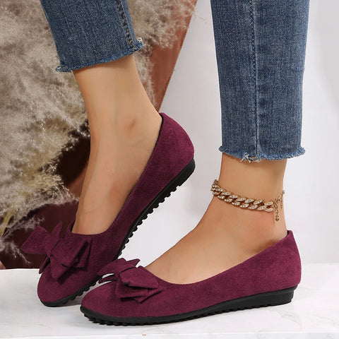 Comfortable women's ballet flats, bow accent, perfect spring footwear, available in various colors.