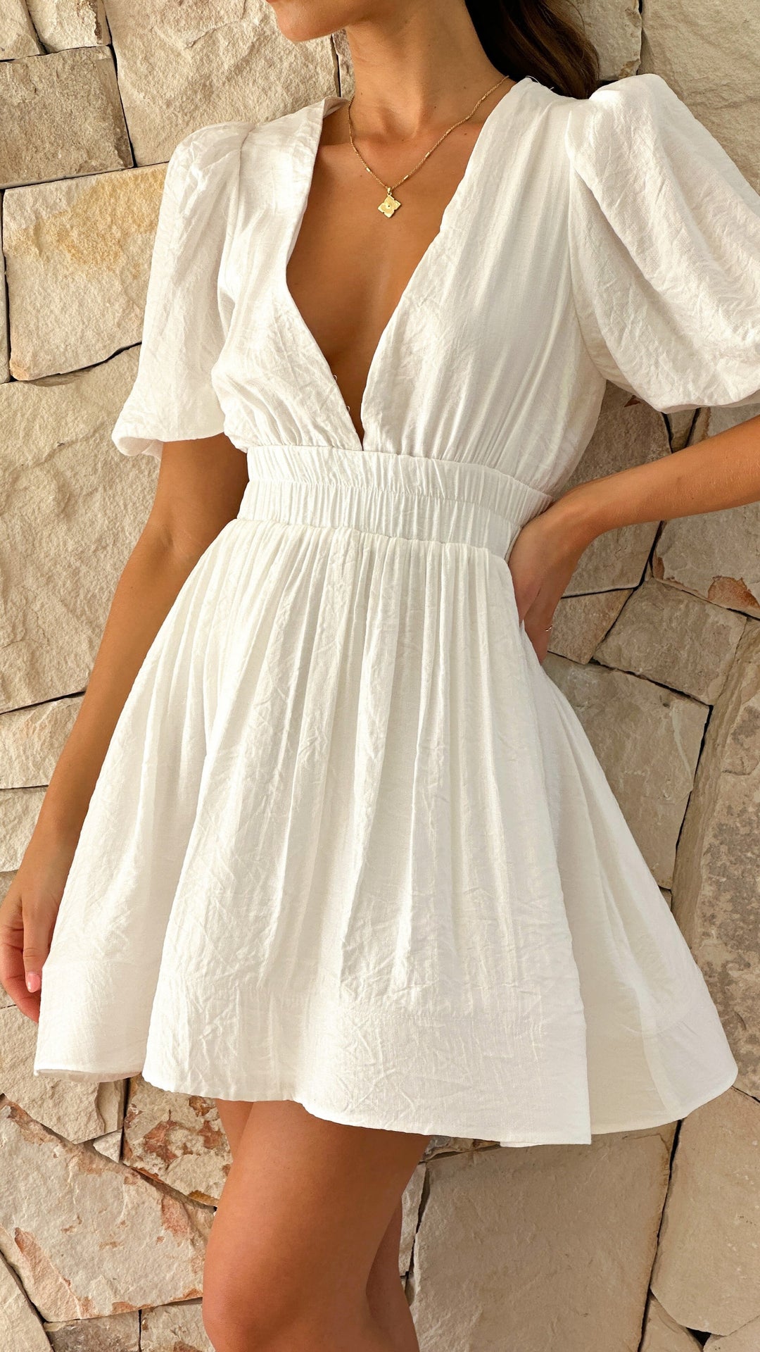 Close-up of the puff sleeves on a women's Light Blue mini dress, highlighting spring fashion and elegant design