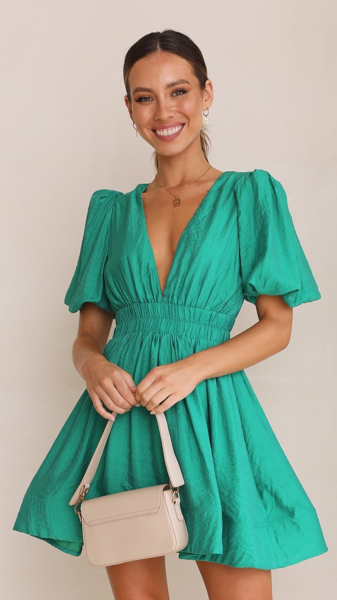 Detail of the fabric and pattern on a women's Light Blue spring puff sleeve mini dress, elegant and casual