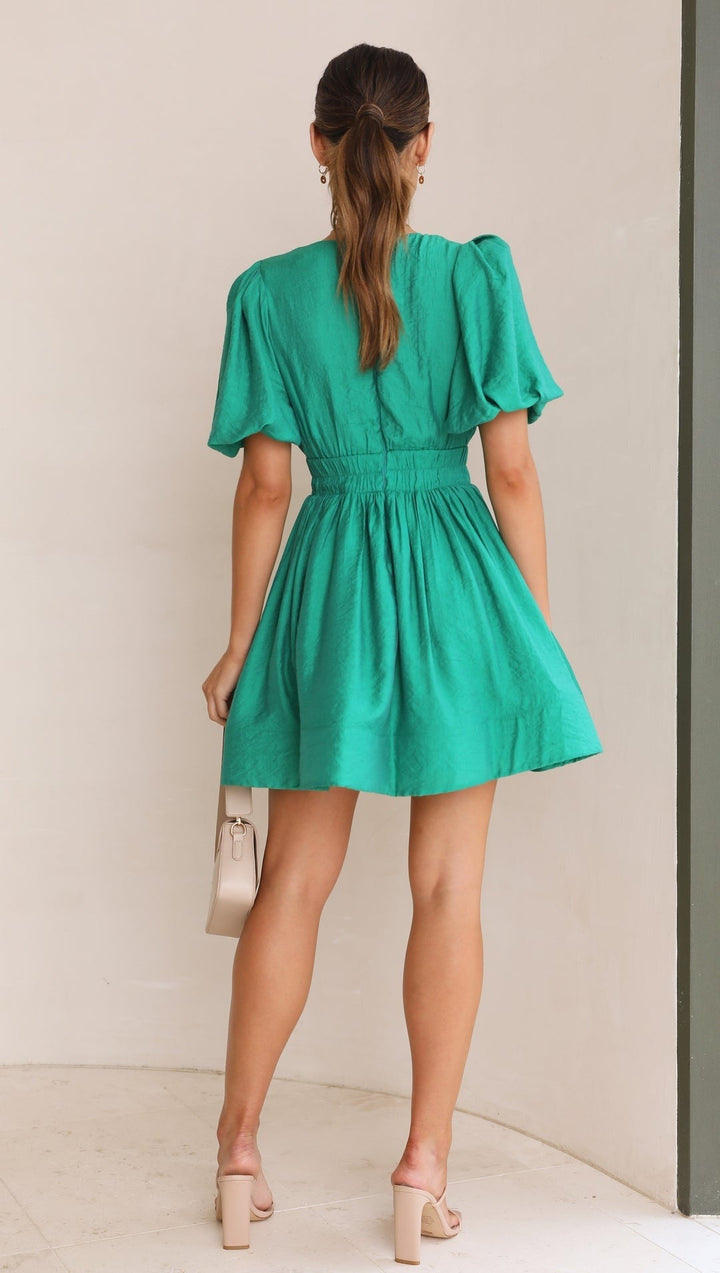Model wearing a women's Light Blue puff sleeve mini dress, showcasing a stylish spring fashion look