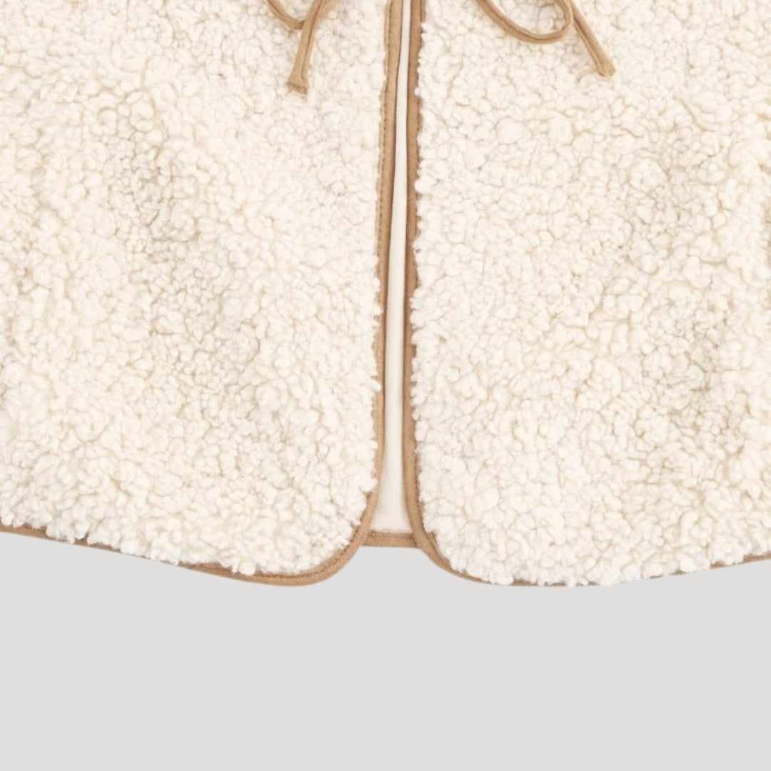 Casual tie-front vest in beige for women, versatile for spring, a cozy layering piece.