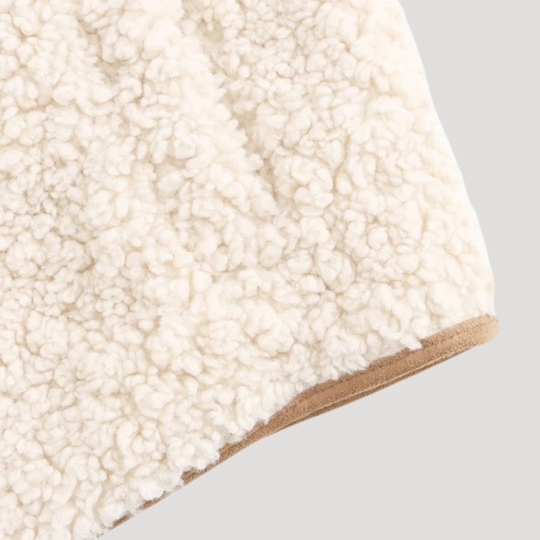 Lightweight beige vest with a fashionable tie front, designed for women's spring layering.