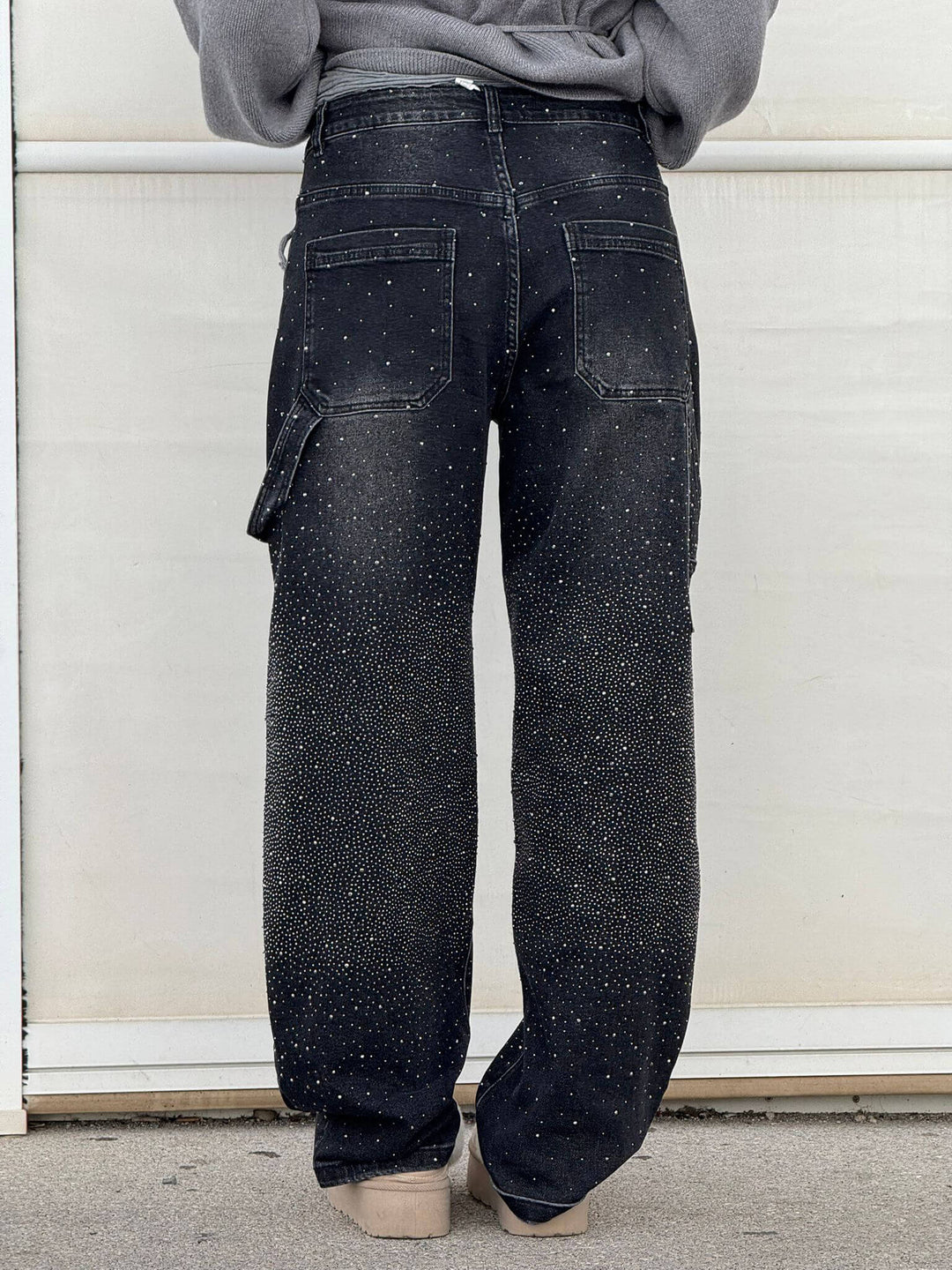 Side profile of women's flowy wide leg pants, highlighting the generous cut and elegant drape.