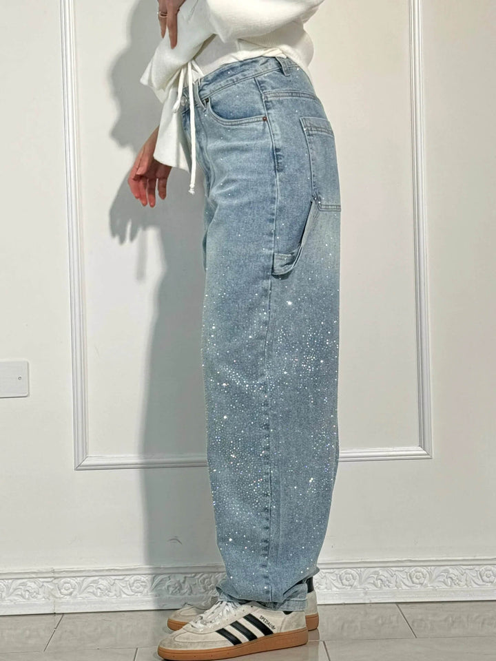 Close-up of the fabric detail on women's high-waisted wide leg flowy pants for spring fashion.